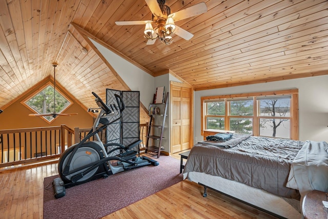 bedroom with lofted ceiling, multiple windows, and wooden ceiling