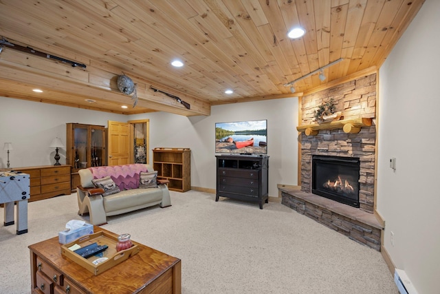 carpeted living area featuring a baseboard radiator, recessed lighting, wooden ceiling, baseboards, and a fireplace