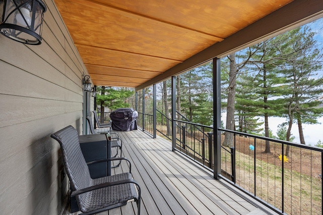 wooden terrace featuring grilling area