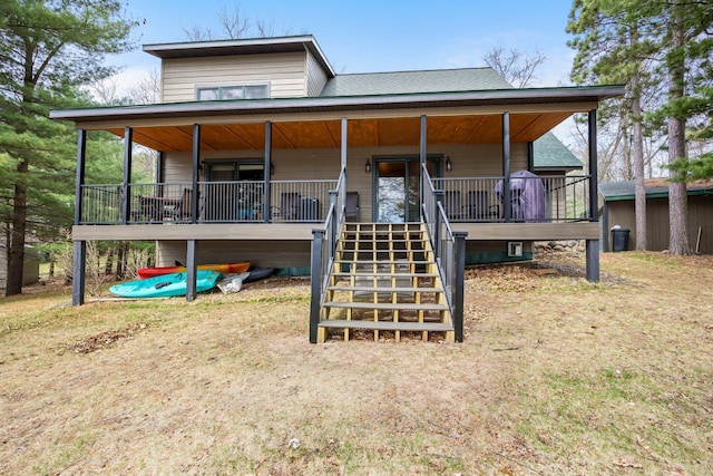 view of front of property featuring a porch and stairs