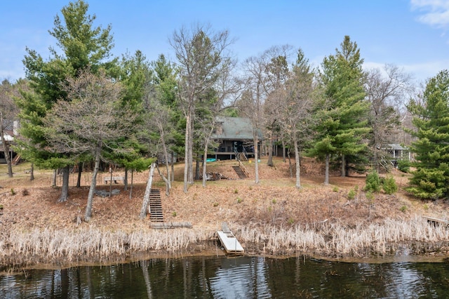 exterior space featuring a water view and stairway