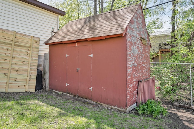 view of shed featuring a fenced backyard
