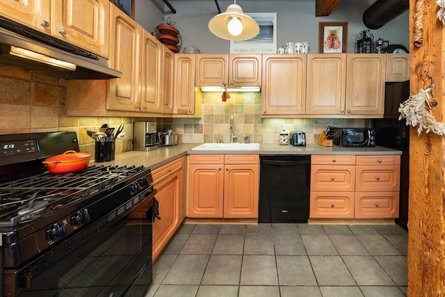 702 1st St Unit 521, Minneapolis, MN 55401 - kitchen with a sink, under cabinet range hood, decorative backsplash, tile patterned floors, and black appliances