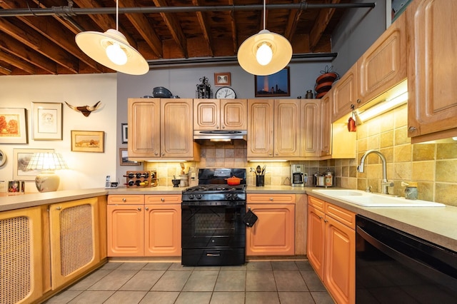 702 1st St Unit 521, Minneapolis, MN 55401 - kitchen featuring tile patterned floors, under cabinet range hood, light countertops, black appliances, and a sink