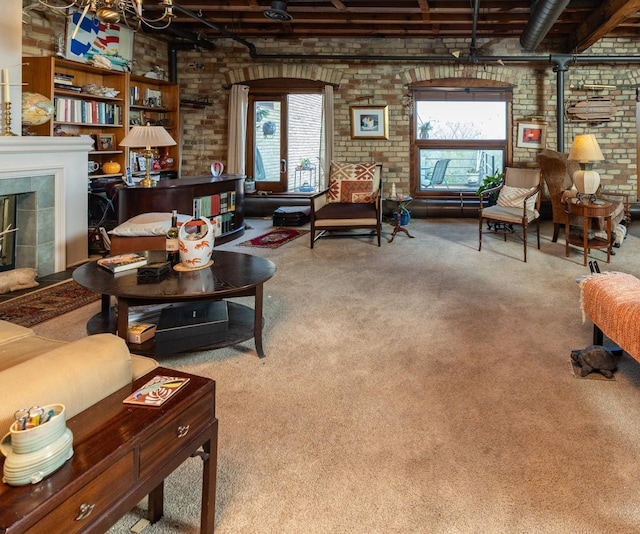 702 1st St Unit 521, Minneapolis, MN 55401 - carpeted living room featuring a wood stove, a tile fireplace, and brick wall