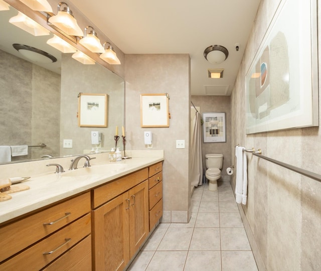 702 1st St Unit 521, Minneapolis, MN 55401 - full bathroom featuring toilet, a shower with curtain, tile patterned floors, and vanity