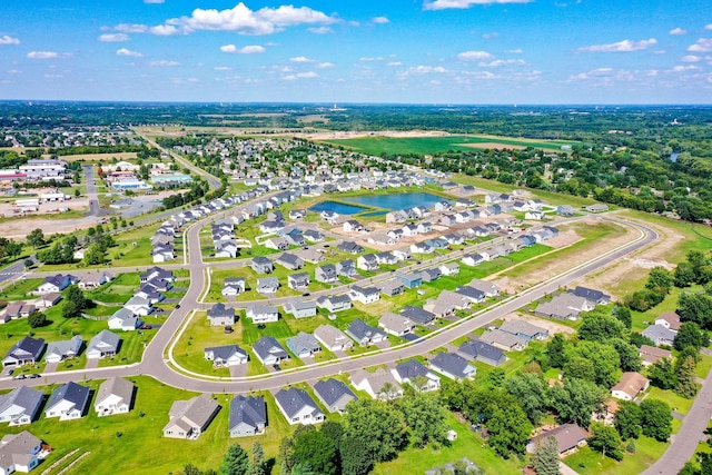 birds eye view of property featuring a residential view and a water view