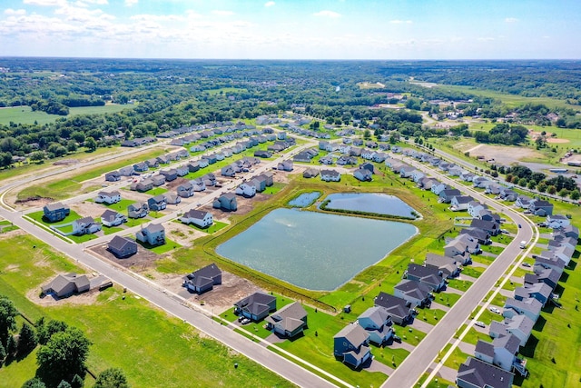drone / aerial view with a water view and a residential view