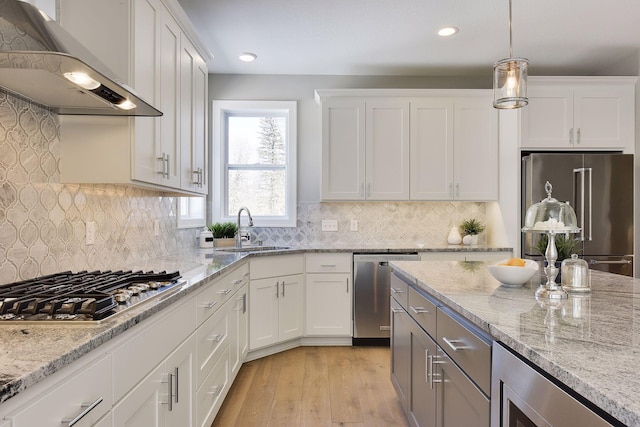 3542 Leroy St, Deephaven, MN 55391 - kitchen with appliances with stainless steel finishes, a sink, exhaust hood, white cabinetry, and recessed lighting