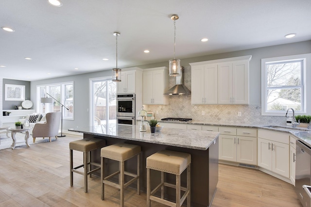 3542 Leroy St, Deephaven, MN 55391 - kitchen with wall chimney exhaust hood, a sink, stainless steel appliances, white cabinets, and decorative backsplash