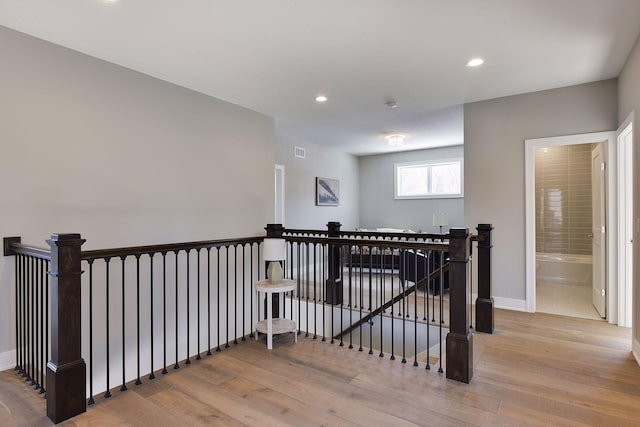 3542 Leroy St, Deephaven, MN 55391 - hall with an upstairs landing, wood finished floors, baseboards, and recessed lighting