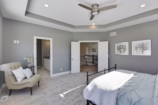 3542 Leroy St, Deephaven, MN 55391 - bedroom with recessed lighting, light colored carpet, baseboards, a raised ceiling, and connected bathroom