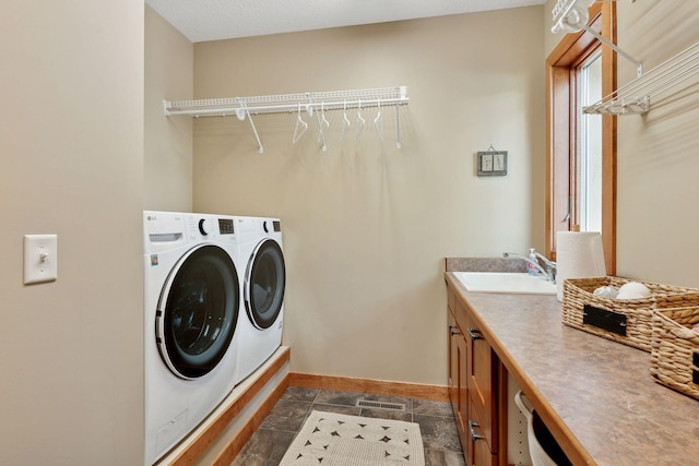 1656 Isabella Pkwy, Chaska, MN 55318 - laundry area featuring cabinet space, washing machine and clothes dryer, and baseboards