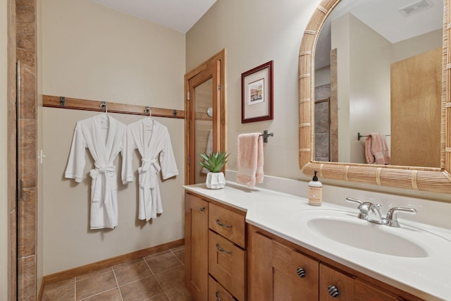1656 Isabella Pkwy, Chaska, MN 55318 - bathroom with vanity, baseboards, and tile patterned floors