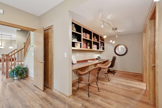 1656 Isabella Pkwy, Chaska, MN 55318 - office space with built in study area, wood finished floors, and baseboards