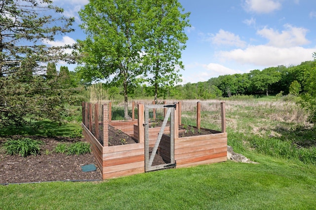 1656 Isabella Pkwy, Chaska, MN 55318 - gate featuring a vegetable garden and a lawn