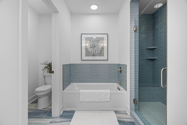 full bath featuring a garden tub, a stall shower, and toilet