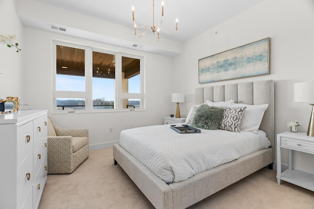 bedroom featuring light colored carpet, baseboards, a notable chandelier, and visible vents