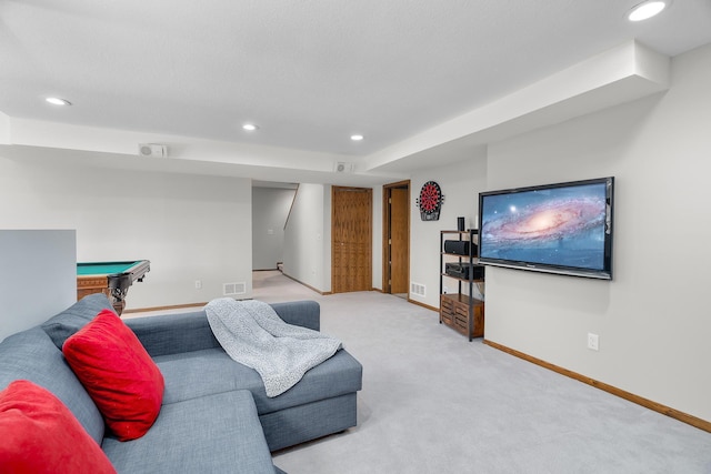 living room with carpet flooring, recessed lighting, baseboards, and visible vents