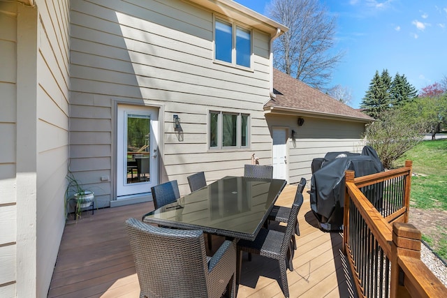 wooden deck featuring outdoor dining area