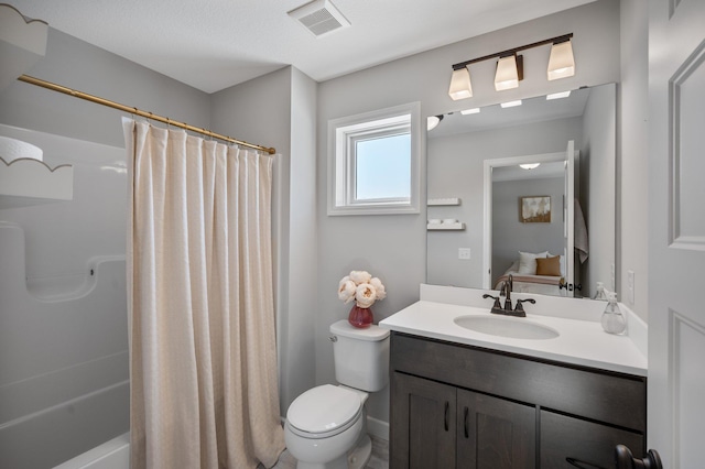 bathroom with vanity, shower / bath combo, toilet, and visible vents