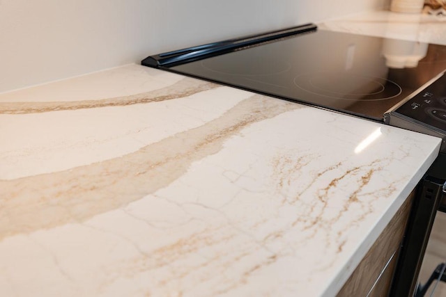 interior details featuring light stone countertops