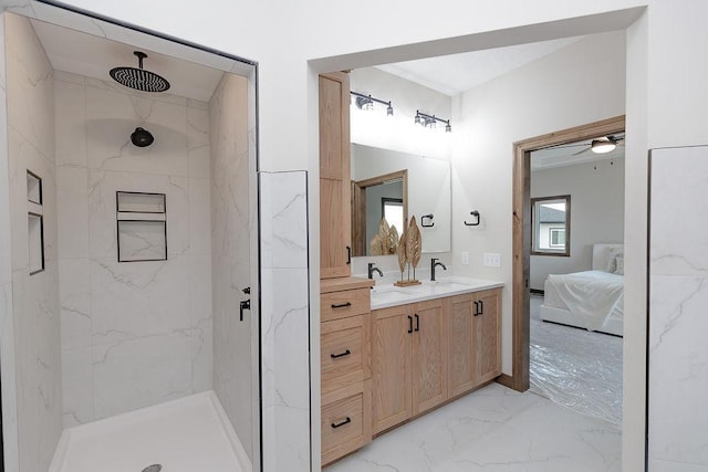 ensuite bathroom with connected bathroom, a sink, double vanity, a marble finish shower, and marble finish floor