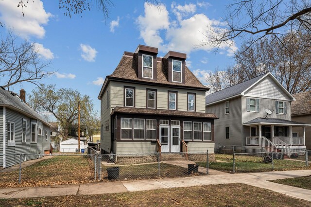 view of front of home with a gate, a fenced front yard, and a shingled roof
