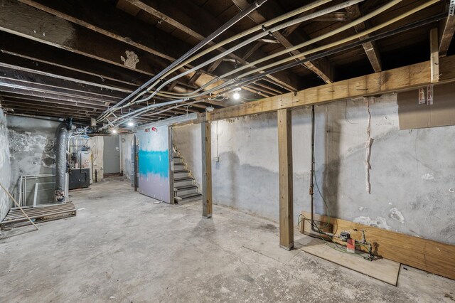 unfinished below grade area with stairs and water heater