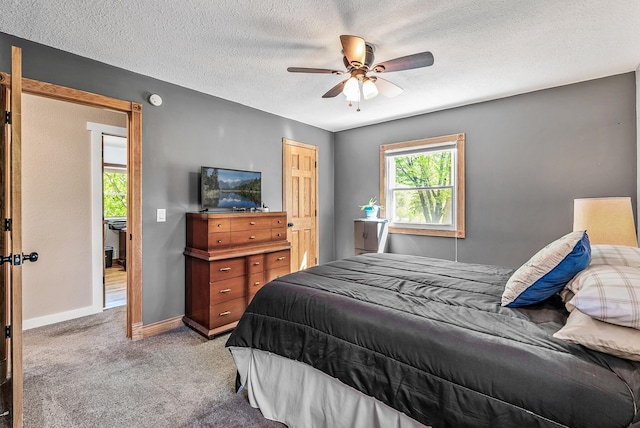 9158 Collins Dr NW, Ramsey, MN 55303 - carpeted bedroom featuring a textured ceiling, baseboards, and ceiling fan