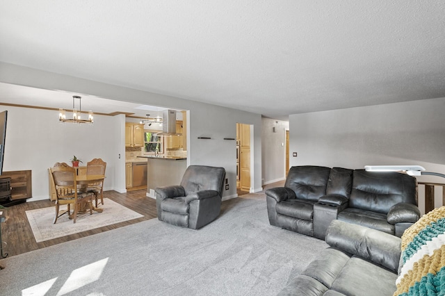 9158 Collins Dr NW, Ramsey, MN 55303 - living area featuring a chandelier, wood finished floors, and baseboards