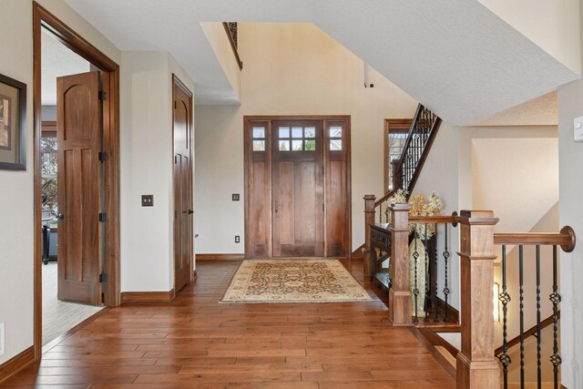 2919 Hilltop Dr, Chaska, MN 55318 - foyer featuring hardwood / wood-style flooring, baseboards, plenty of natural light, and stairway