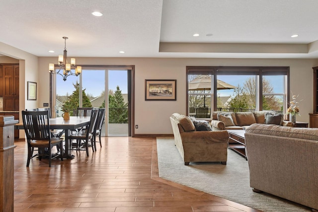 2919 Hilltop Dr, Chaska, MN 55318 - living area featuring a chandelier, recessed lighting, plenty of natural light, hardwood / wood-style floors, and baseboards