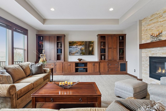 2919 Hilltop Dr, Chaska, MN 55318 - living area with carpet flooring, a tray ceiling, a fireplace, baseboards, and recessed lighting