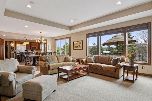 2919 Hilltop Dr, Chaska, MN 55318 - living room featuring recessed lighting, a chandelier, light carpet, and baseboards