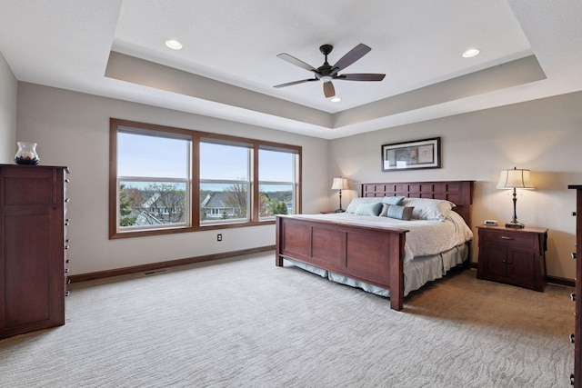 2919 Hilltop Dr, Chaska, MN 55318 - carpeted bedroom with a tray ceiling, baseboards, recessed lighting, and a ceiling fan
