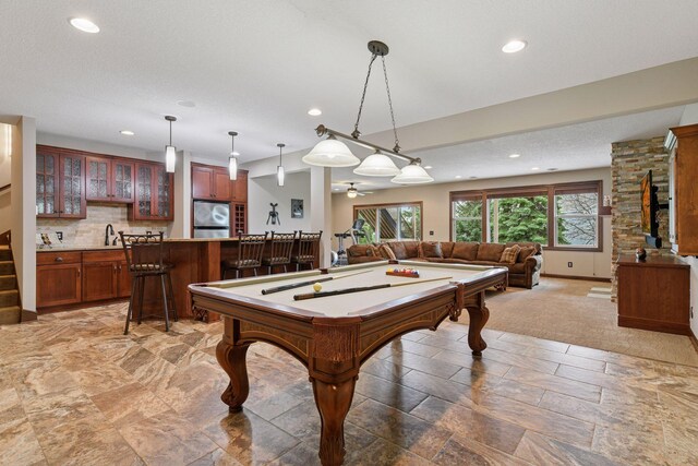 2919 Hilltop Dr, Chaska, MN 55318 - rec room with bar with sink, billiards table, recessed lighting, and baseboards