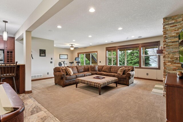 2919 Hilltop Dr, Chaska, MN 55318 - living area featuring light colored carpet, baseboards, recessed lighting, a textured ceiling, and ceiling fan