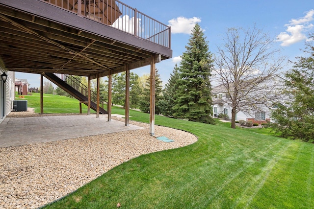 2919 Hilltop Dr, Chaska, MN 55318 - view of grassy yard with a patio, central AC unit, a carport, a wooden deck, and stairway