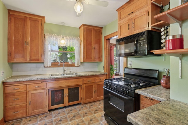 kitchen with black appliances, a sink, open shelves, brown cabinetry, and tasteful backsplash