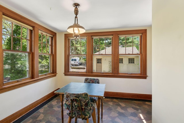dining space featuring baseboards