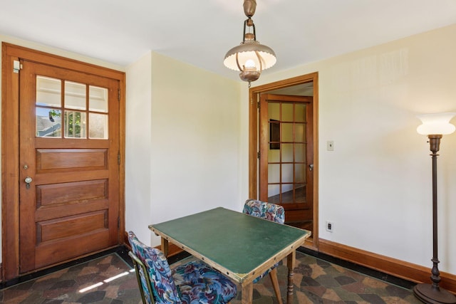 dining room with baseboards