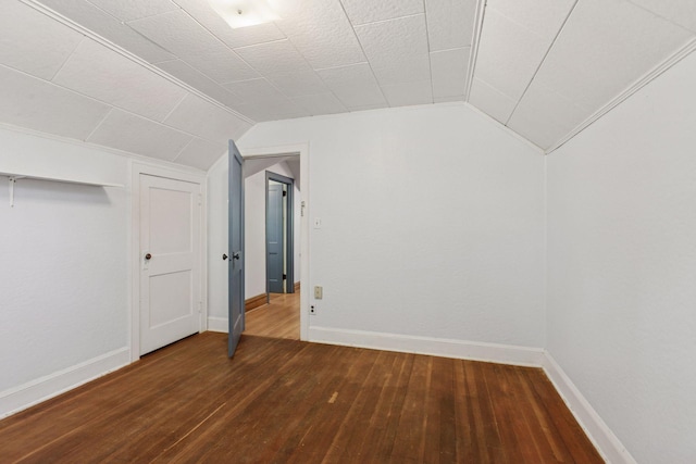 bonus room with lofted ceiling, wood-type flooring, and baseboards