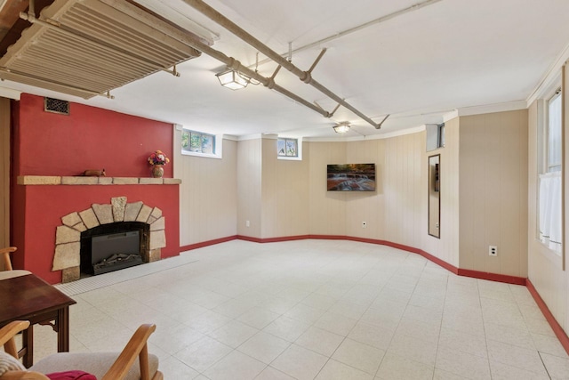 below grade area with baseboards and a fireplace