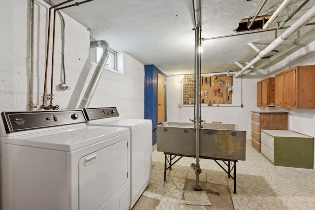 laundry area with independent washer and dryer