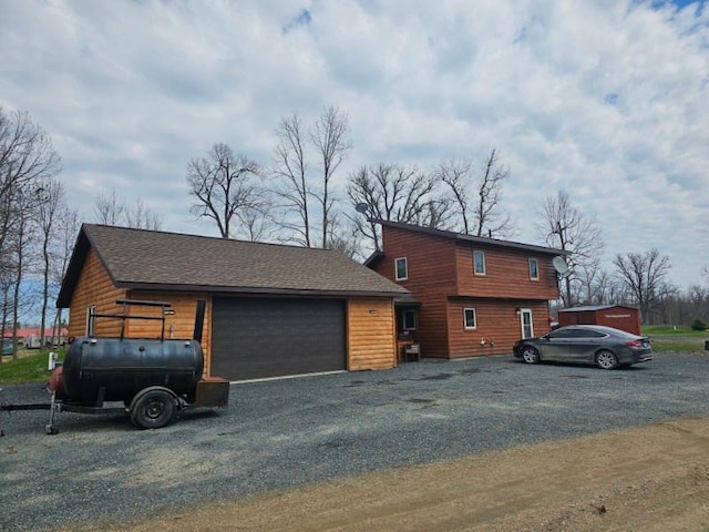 19675 Woody Ln NE, Kelliher, MN 56650 - view of side of home with roof with shingles
