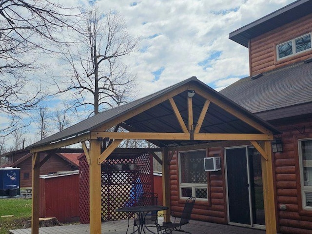 19675 Woody Ln NE, Kelliher, MN 56650 - view of patio / terrace with a gazebo, a deck, and a wall mounted AC