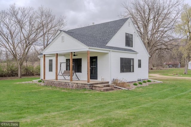 300 Carlson Rd, Cannon Falls, MN 55009 - view of front of home with a ceiling fan, a front yard, and a shingled roof