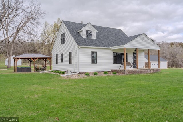 300 Carlson Rd, Cannon Falls, MN 55009 - cape cod home with a porch, a gazebo, a shingled roof, outdoor lounge area, and a front lawn