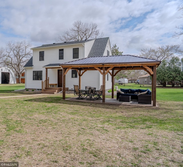 300 Carlson Rd, Cannon Falls, MN 55009 - back of house with a lawn, outdoor lounge area, a gazebo, and a shingled roof
